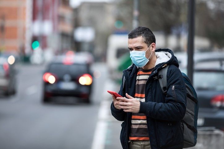 A man waits for a ride during the coronavirus pandemic