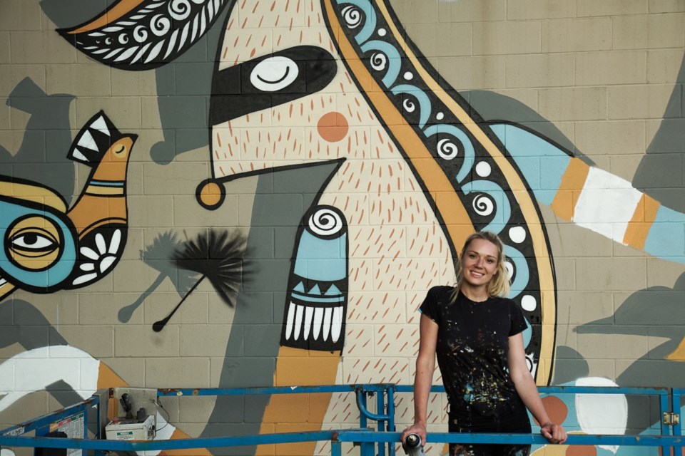 Mural artist Ola Volo is expected to complete her mural on the east wall of the Rocky Point Ice Cream production facility this weekend. It will likely become a Port Moody landmark with its images of Port Moody wildlife, such as the bear, pigeons and deer.