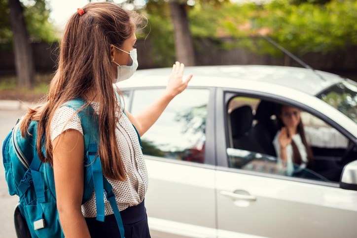 Mother drops her daughter off at school amid COVID-19 pandemic