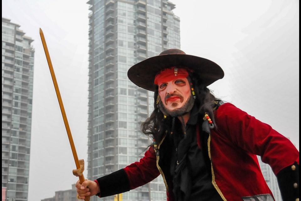 A pirate volunteer atop Coquitlam Centre in an event repurposed for 'landlubbers' after the COVID-19 pandemic made it impossible to socially distance aboard a ship.