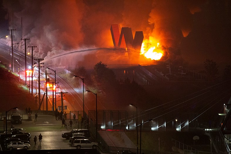 New Westminster's famous 'W' threatened by flames at Westminster Pier Park. Rick Fabbro photo