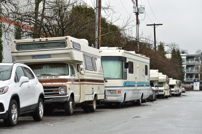 Recreational vehicles line a Vancouver street.