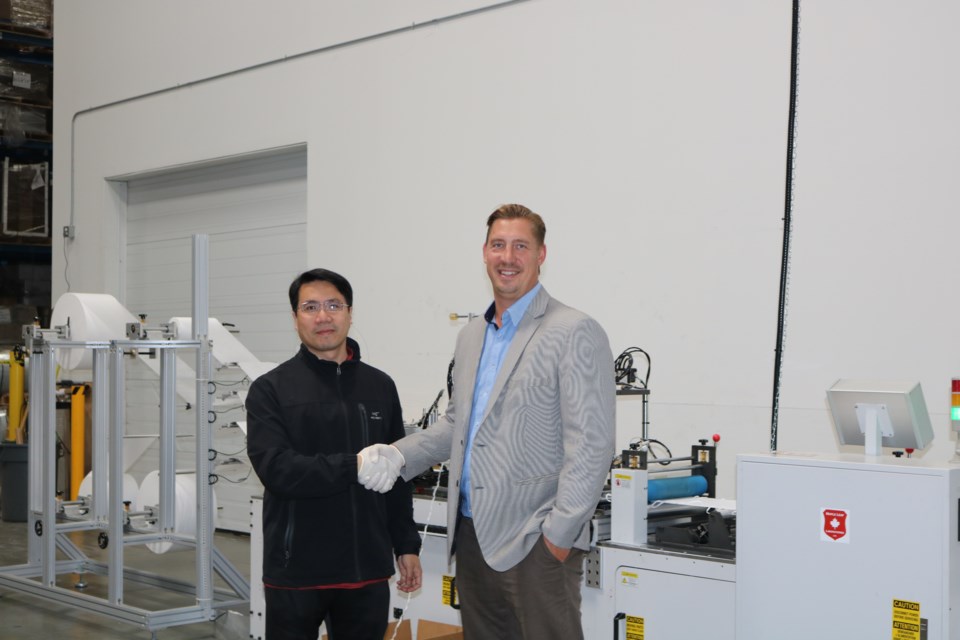 Guoren Zhang(left), instructor at Kwantlen Polytechnic University’s School of Business, and Mark Rose, CEO of Layfield Group. Photo submitted