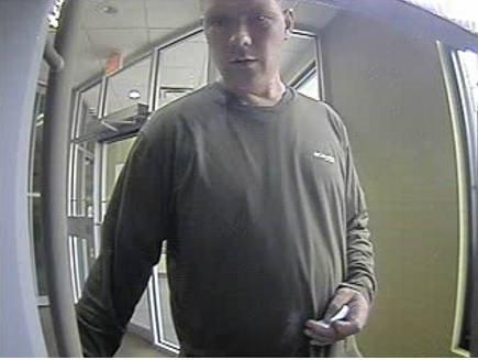 Victoria police have released new photos of a suspect in a robbery at an ATM on Sept. 13, 2020.
