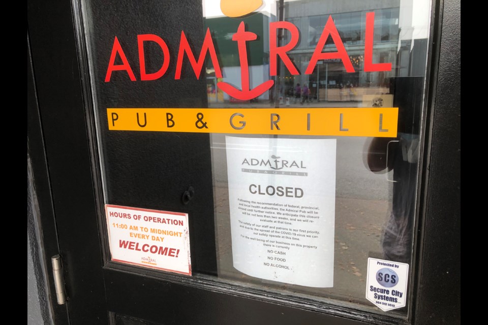 A sign on the door of the Admiral Pub and Grill in North Burnaby. Chris Campbell photo
