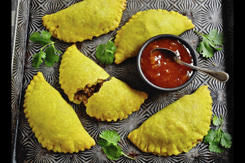 These Jamaican-style patties are savoury, nicely spiced, meaty patties you can eat with your hands. The yellow colour in the pastry comes from turmeric or curry powder. ERIC AKIS