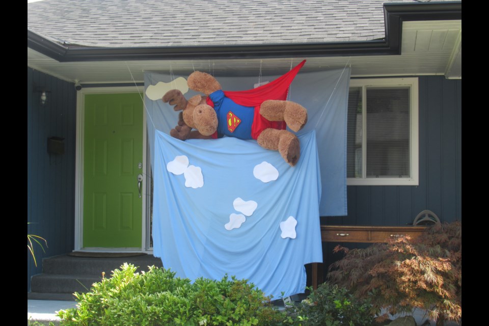 SuperMoose takes flight at a Blackman Street home - one of many incarnations of the stuffed moose display that caught the eye of a young reader.