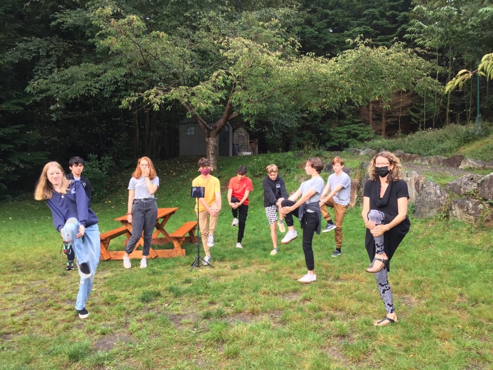 Students stretching on the grass