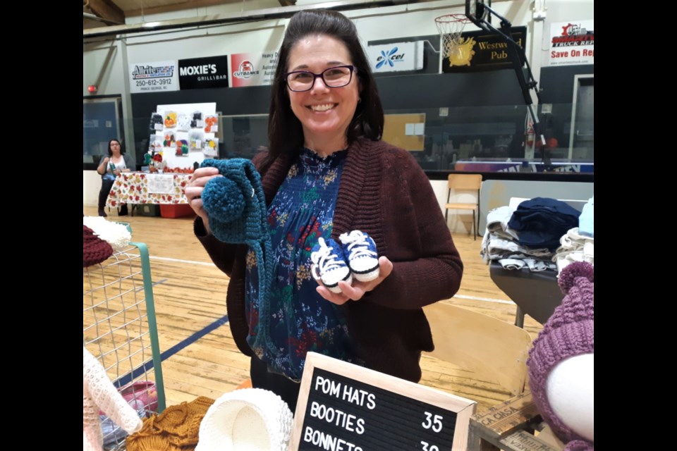 Andrea Wood, owner of Mama Crochet Co., has been busy preparing for the fall and Christmas craft season making baby clothes. Wood was one of the vendors in Sunday's Small Business Fair at the Roll-A-Dome.