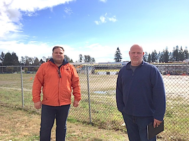 Centennial parents, including Tony Oljaca and Giulio Caravatta, are upset that it's taken so long to build a neighbourhood learning centre and artificial turf field, both of which should have been built by now.