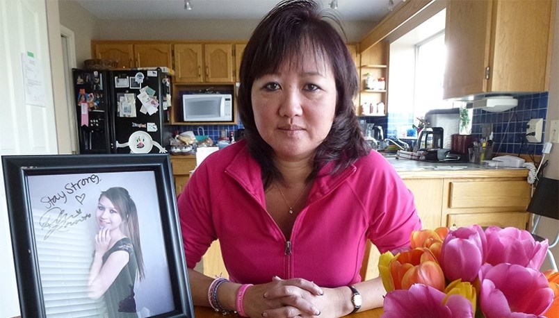Carol Todd, a Port Coquitlam teacher, with a photo of her daughter, Amanda,