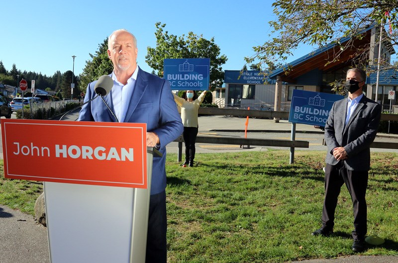 BC NDP leader John Horgan re-announced the party's commitment to build new middle and high schools in Fin Donnelly's Coquitlam-Burke Mountain riding during a campaign stop at Nestor elementary school on Tuesday, Sept. 29.