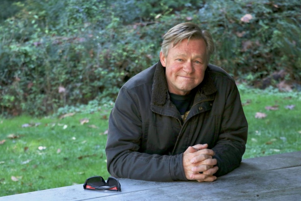 John Overbye by a picnic table