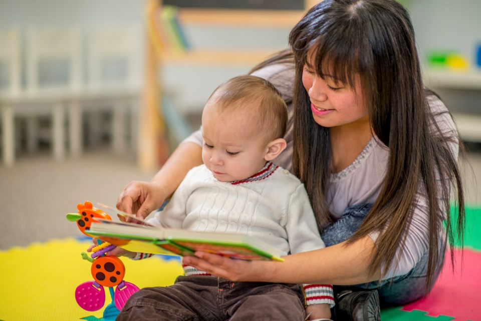early learning, child reading, toddler reading, stock photo