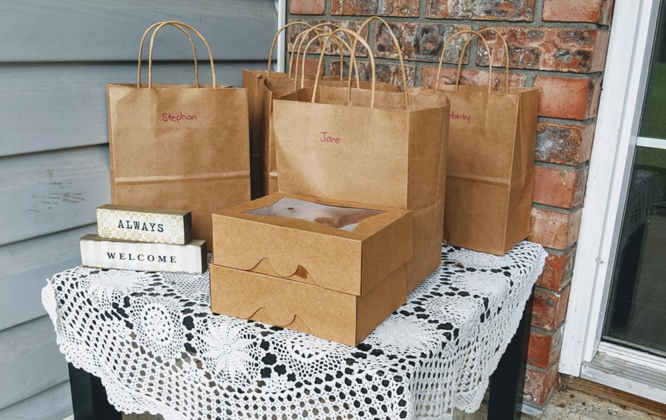 Adel Cotichini leaves her bread orders on a pandemic-friendly table outside her front door.