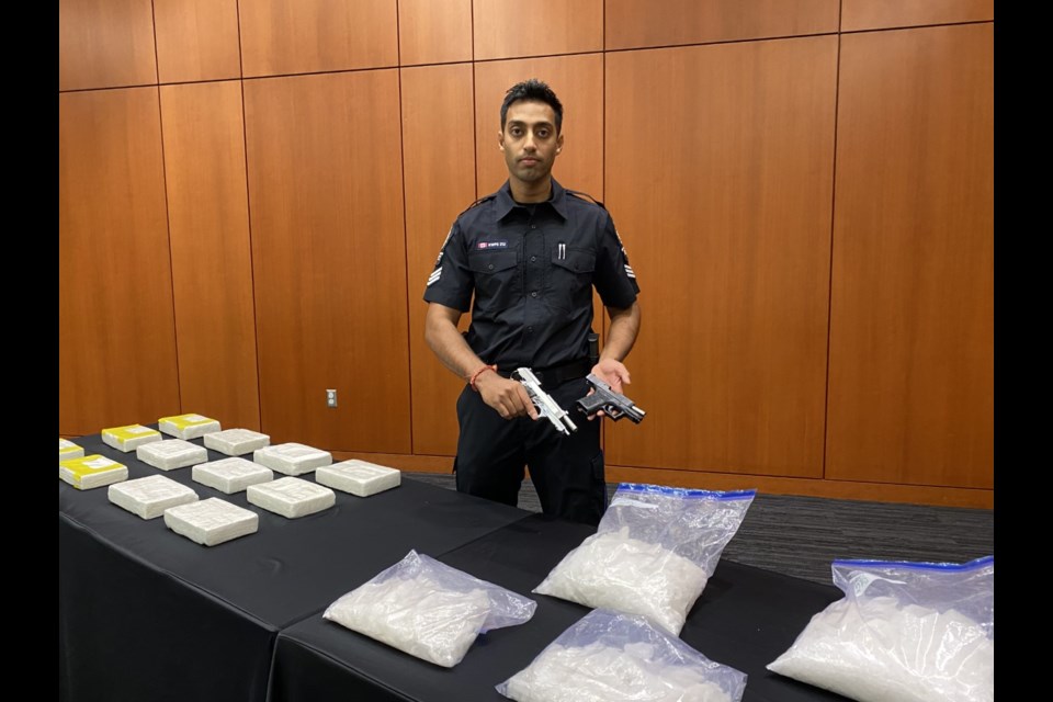 New Westminster Police Department spokesperson Sgt. Sanjay Kumar displays some of the items seized during a "significant" drug seizure. A suspect has been arrested and police have recommended charges to Crown counsel.