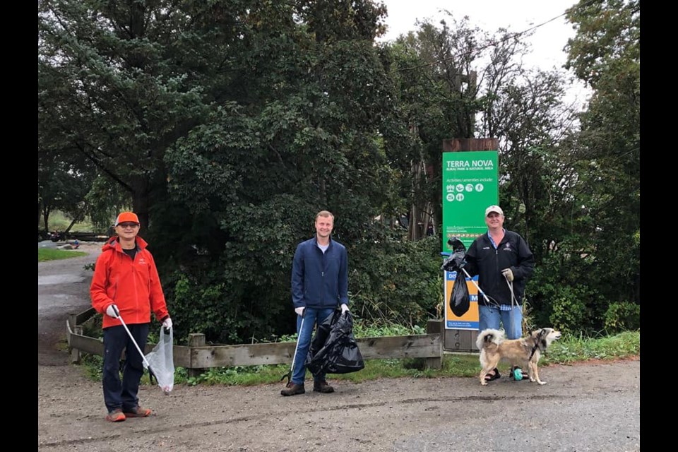 Chris Pereira (in the middle) was at the last cleanup event. Photo submitted