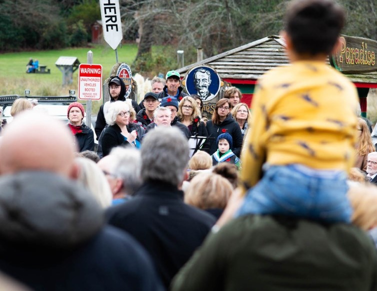 A crowd of people with Lorraine speaking into a mic