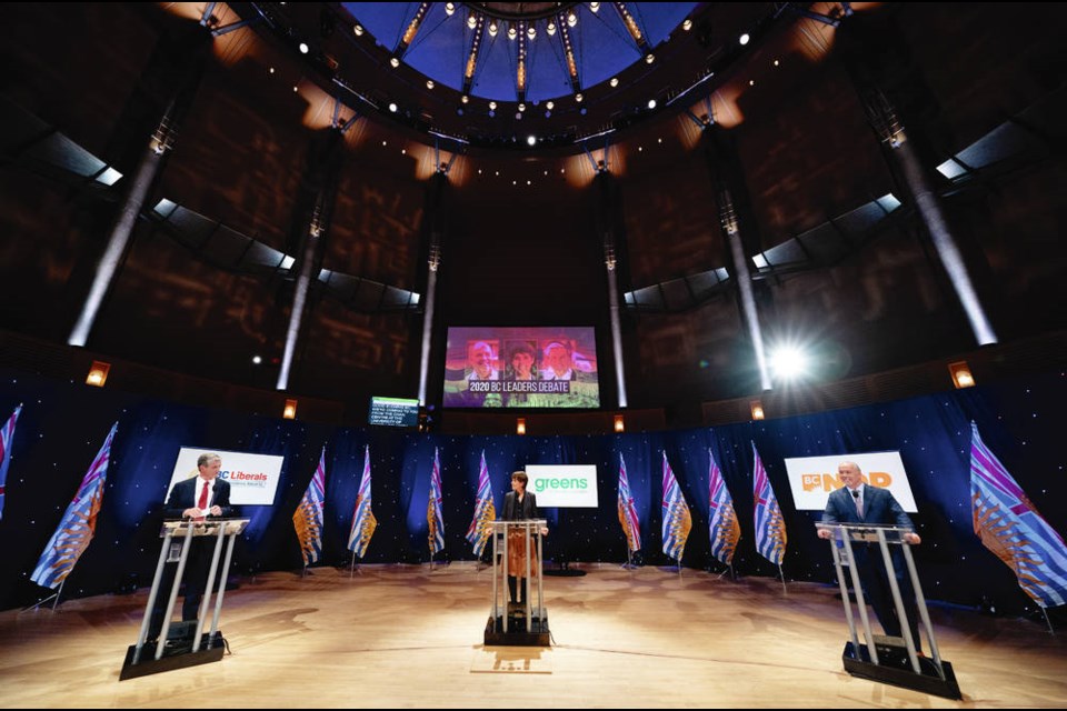 NDP Leader John Horgan, right to left, Green leader Sonia Furstenau and Liberal leader Andrew Wilkinson take part in a debate at the Chan Centre in Vancouver, B.C., Tuesday, October 13, 2020. THE CANADIAN PRESS/Jonathan Hayward