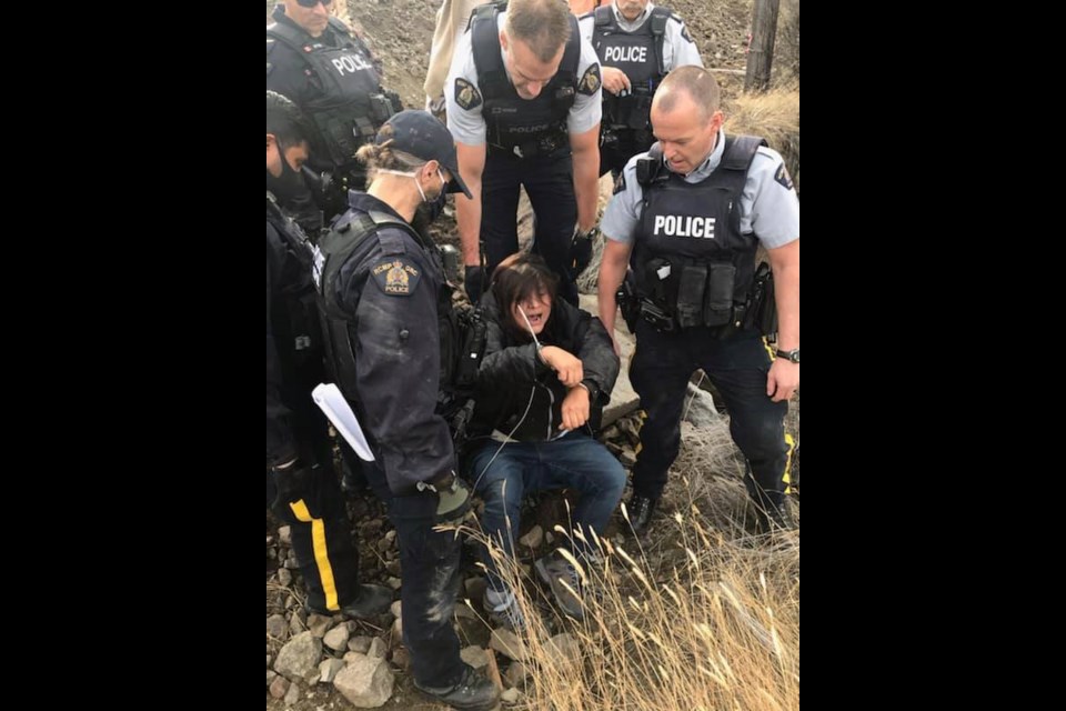 Police arrest a protester at Trans Mountain's Mission Flats worksite on Oct. 15.