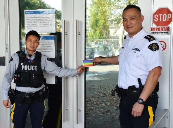 Const. Jace Rondario and Supt. Will Ng at the front doors of Richmond detachment. Photo submitted