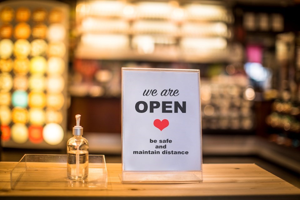 hand sanitizer and re-open sign