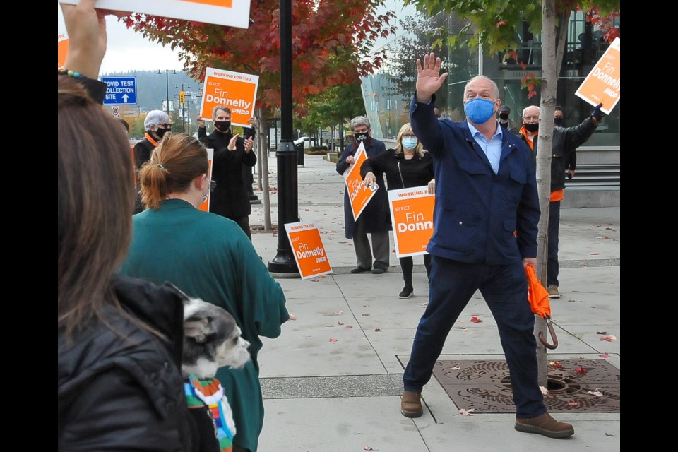 BC NDP Leader John Horgan at a sign waving event near the Lincoln SkyTrain station in Coquitlam Tuesday, Oct. 20. As the campaign enters its last week, Horgan is looking to get out the party's end game messaging to key ridings like Coquitlam-Burke Mountain.