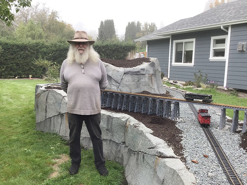 CROSSING PATTERN: A logging locomotive birthday gift and a lifetime of interest in railroads led Powell River resident George Doubt to create a model train display at his home in Wildwood. Desiray Fenrick photo