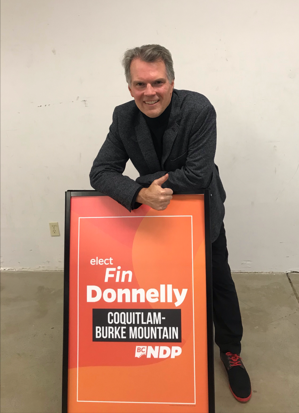 BC NDP candidate for Coquitlam-Burke Mountain Fin Donnelly celebrates on election night as his lead