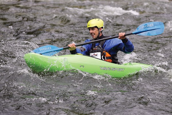 Mark Williams of team Cut and Exposed completes the final leg of Red Bull's Divide and Conquer race held June 8 on the North Shore. The three-person relay began with a trail run followed by a mountain bike stage and finished with a paddle down the Capilano River.