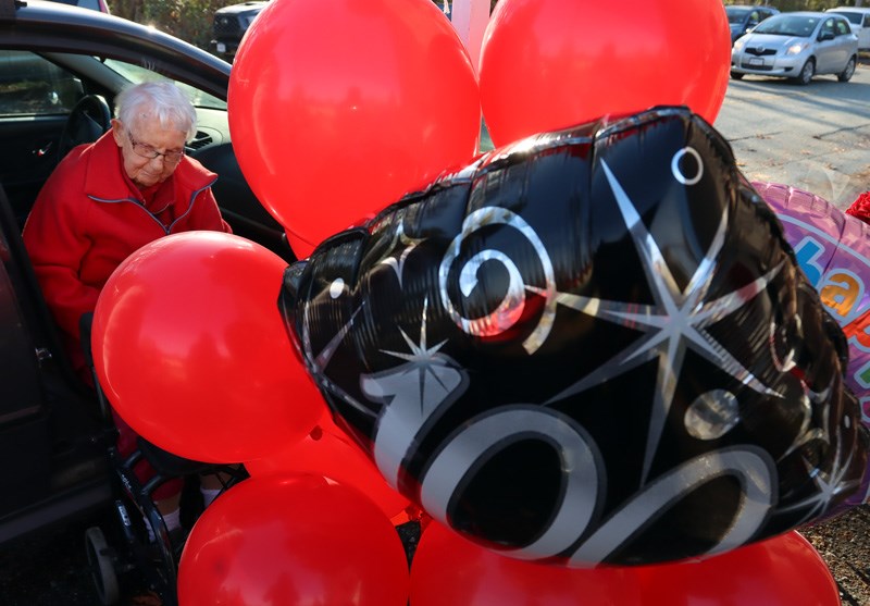 MARIO BARTEL/THE TRI-CITY NEWS Mary Anne Cooper arrives for her "surprise" celebration of her 106th birthday on Friday at the Ioco townsite. The event was a special drive-by parade of decorated vehicles and special guests.