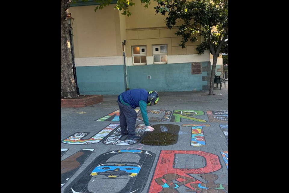 Victoria police have released a photo of a man seen defacing the More Justice, More Peace painting in Bastion Square on Saturday, Oct. 31, 2020. VIA VICTORIA POLICE DEPARTMENT