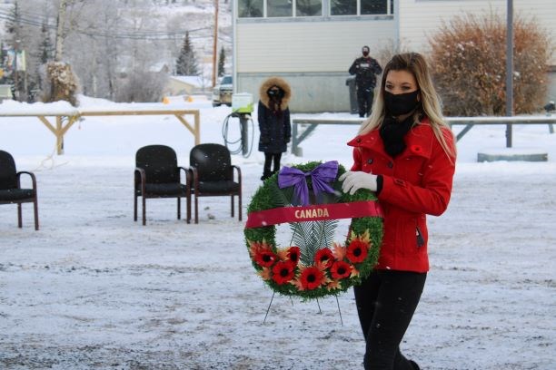 Hudson's Hope Recreation and Events and Co-ordinator Kristina Coombs places a wreath, Nov. 11, 2020.