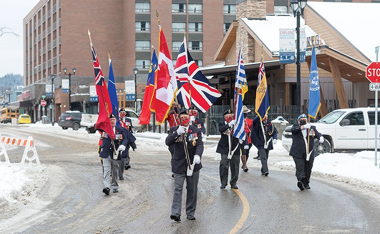 Citizen Photo by James Doyle/Local Journalism Initiative. The Royal Canadian Legion Colour Party marches towards the cenotaph in front of city hall on Wednesday morning at the Prince George Remembers Remembrance Day ceremony.