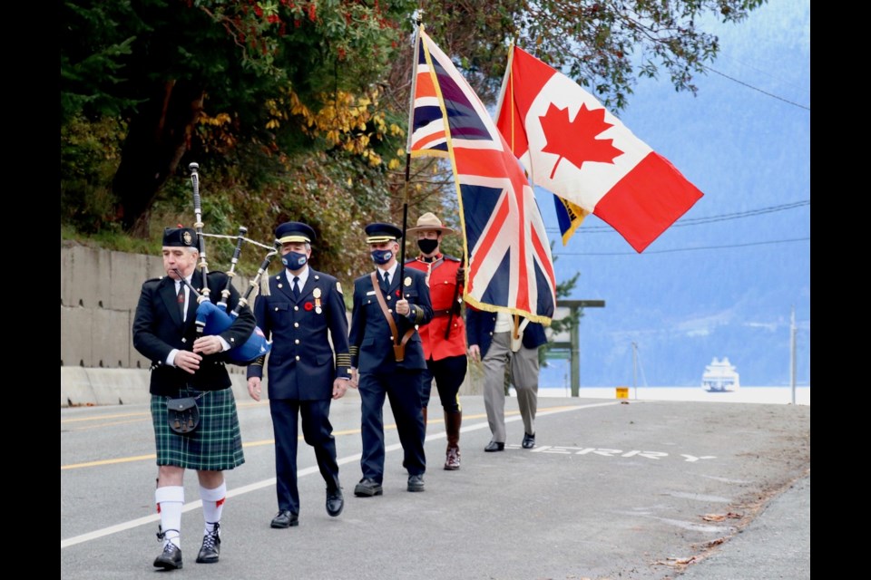 The ceremony opens with piper Derrick Davidson, fire chief Aaron Hanen, former fire chief Ian Thompson, Bowen RCMP Cpl. Adam Koehle and Lance Weismiller