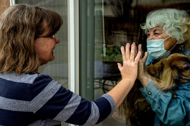 A daughter visits her quarantined mother during the COVID-19 pandemic