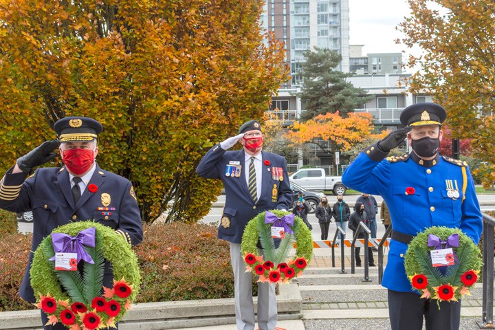 Tim Armstrong, New Westminster fire chief, (left), Terry Leith, president of the Royal Canadian Legion Branch #2 (middle), Chief Const. Dave Jansen of the New West police (right) at the Nov. 11 New Westminster Remembrance Day ceremony. Photo by Lief Garrett