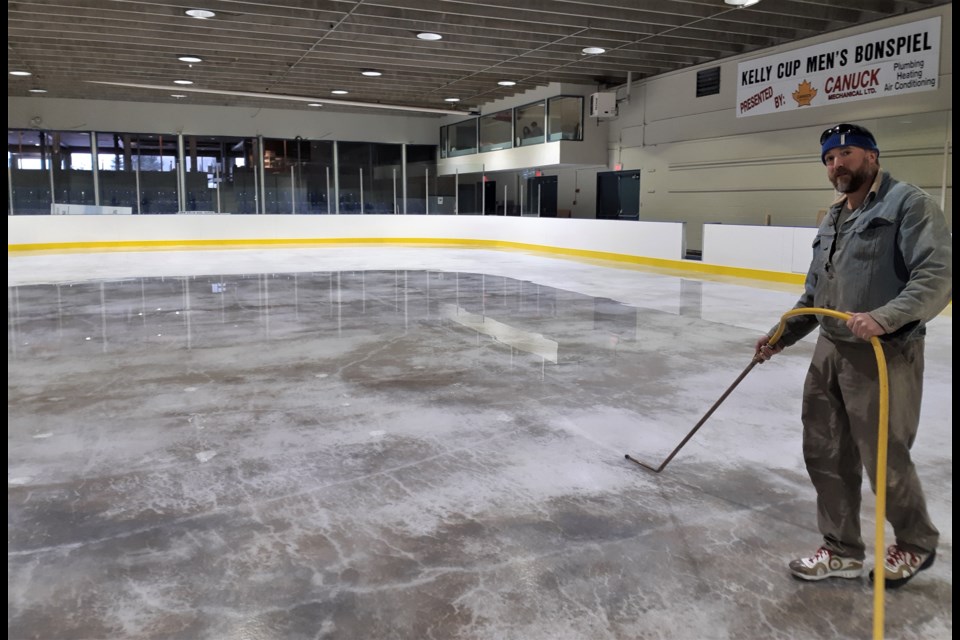 Mike Peterson floods the ice of the 125-foot long, 55-foot wide rink at the Prince George Golf and Curling Club. The private venture Peterson has started with Chris Hunter will provide a new practice and game facility for hockey players, ringette players and figure skaters.