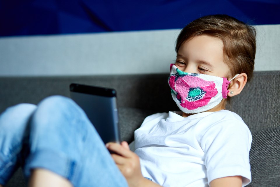 child in mask, tablet, screen time