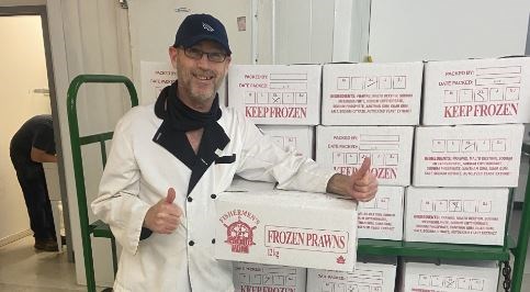 Mike Miller, kitchen supervisor at the UGM New Westminster Resource Centre, was elated to receive the “riches of the sea” due to a donation from Piva Modern Italian Restaurant.