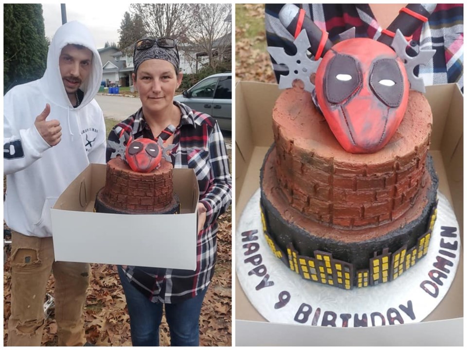 Damien's parents, Thomas Smith and Tiffanie Trudell, with Damien's Deadpool-themed cake. The nine-ye