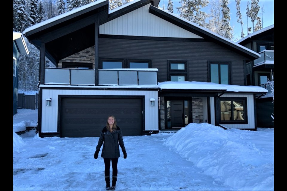 Spruce Kings Show Home Lottery manager Liz Bennett shows off the grand prize, 1 2,600 square foot house in the Aberdeen Glen subdivision that one lucky ticket holder will win in the draw on April 30, 2021.