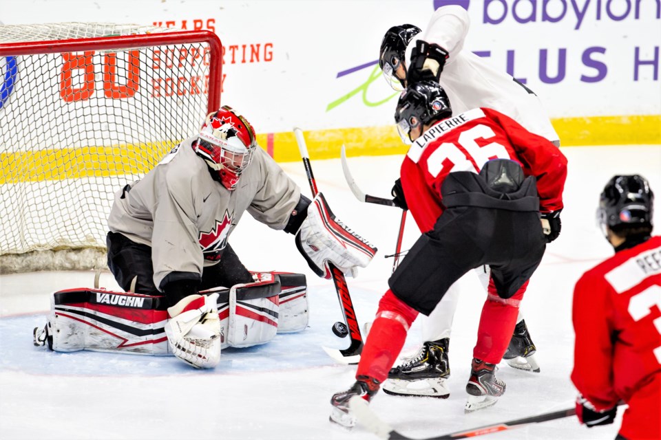 Prince George Cougars goalie Taylor Gauthier makes a save to deny Hendrix Lapierre during Team Canada's world junior camp intrasquad game Nov. 21 in Red Deer.