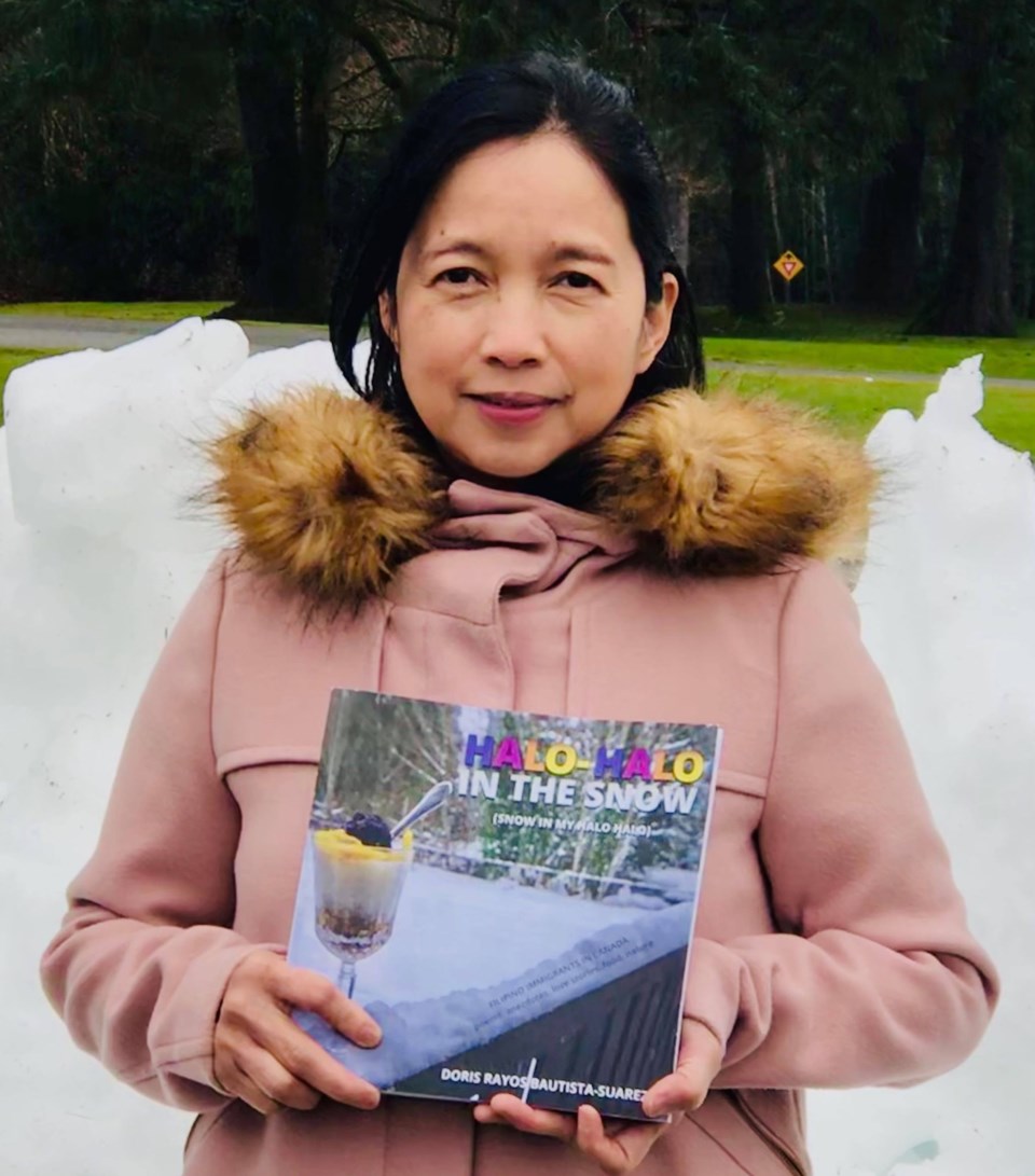 Doris Suarez with her book.