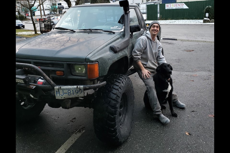 Marc Dandurand, his truck and his dog Reef.