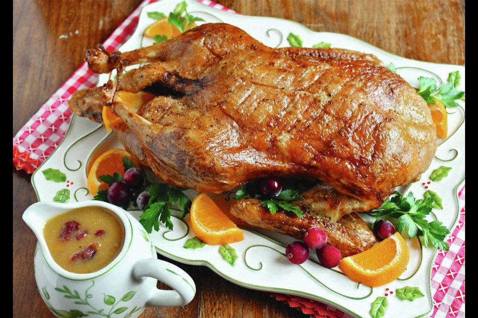 Crispy skinned roast duck is served with a zesty orange ginger cranberry sauce. ERIC AKIS PHOTOS