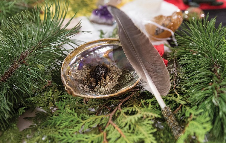Citizen Photo by James Doyle/Local Journalism Initiative. Burning sage and an eagle feather sits on some cedar branches on Thursday afternoon at UNBC’s Gathering Place as part of Four Connections Celebration: Winter Solstice 2020.