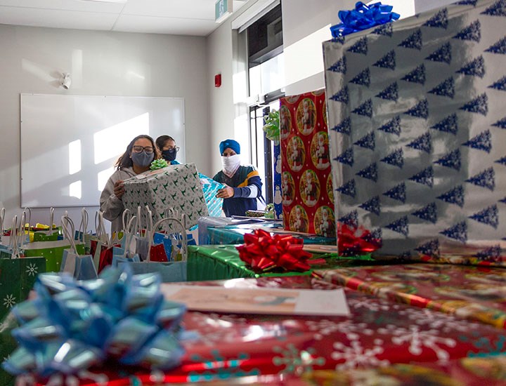 Baljot Mann and Arlene Bassi, with the helping hands of their parents, delivered care packages for r