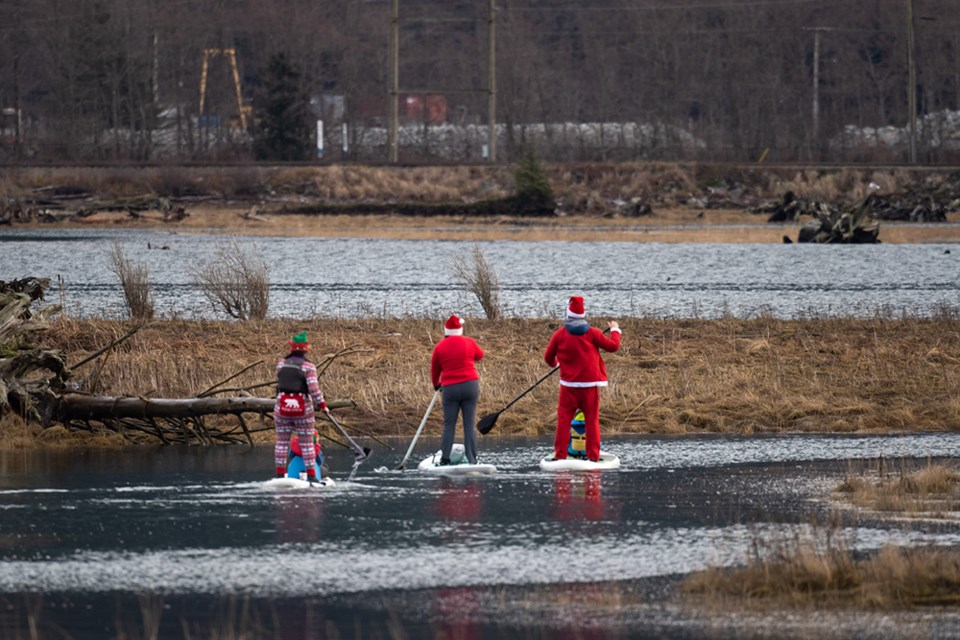 Santa and elves paddleboard in Howe Sound_4