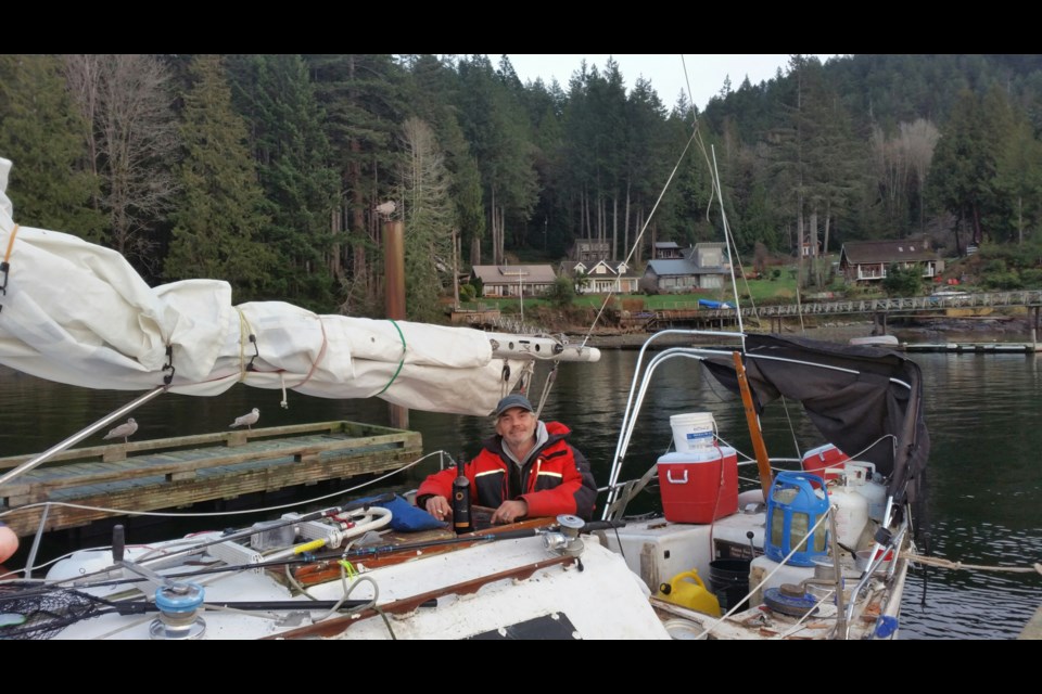 Kelly Kurik on his sailboat.